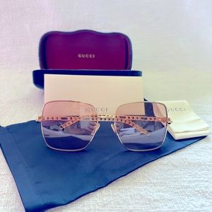 Pink Gucci sunglasses with gold frames